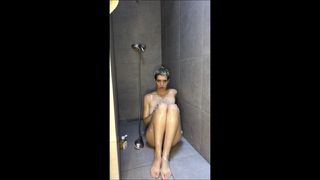 Shy girl in the shower puts soap on her pussy 